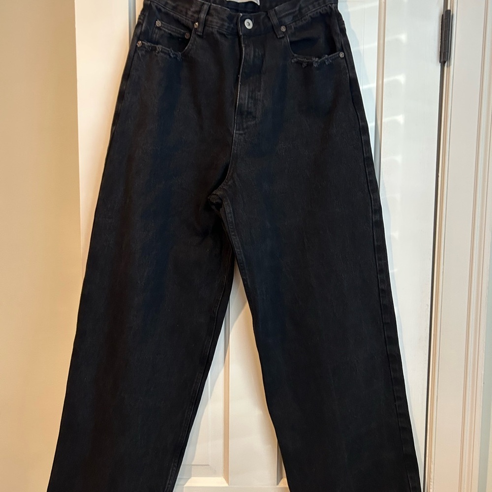 COLE HENRY baggy relaxed fit jeans with distressed pockets and hem.